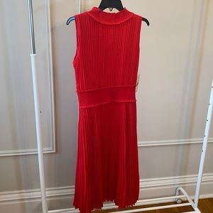 Red midi dress with pleat details